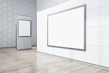 Clean gallery interior with wooden flooring, empty white mock up posters on concrete wall. Museum concept. 3D Rendering.
