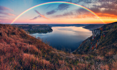 colorful rainbow over river canyon. autumn landscape. nature of Ukraine 