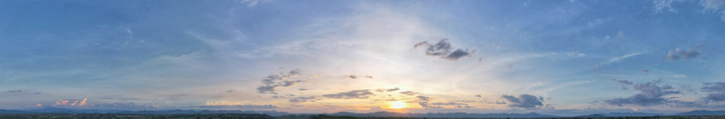 Aerial view of the sunset sky, Panoramic beautiful landscape with  twilight sky, Sun bursting through clouds.