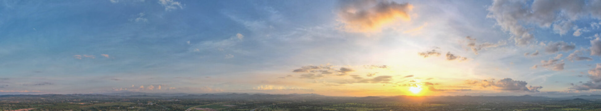 Aerial view of the sunset sky, Panoramic beautiful landscape with  twilight sky, Sun bursting through clouds.