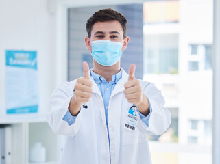 Fototapeta na wymiar Covid, doctor thumbs up and face mask for medical corona virus healthcare, compliance safety and protection. Covid 19 health care, vaccine medicine and hospital or clinic professional with thank you