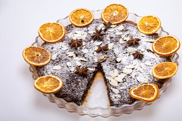 Tart with poppy seeds and fruit sprinkled with powdered sugar