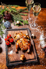Fototapeta na wymiar Christmas chicken and champagne on the table