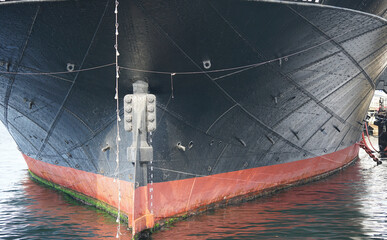 The stern of the ship anchoring in the port