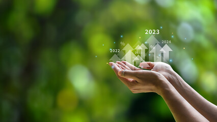 Future planning goals and new visions for the year 2024. Businessman background green environment. with arrow icon increasing future company growth 2024 to 2025 planning opportunities challenges