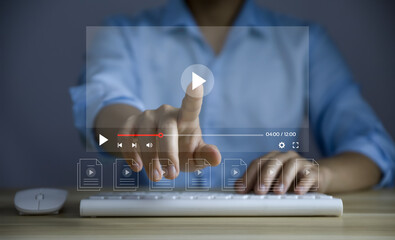 Businessman using laptop watch live streaming online on virtual monitors, digital multimedia...