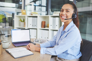 Call center, customer support and portrait of Latin woman at desk in corporate office on laptop, headset and smile. Receptionist, crm and friendly female consulting agent working in customer service