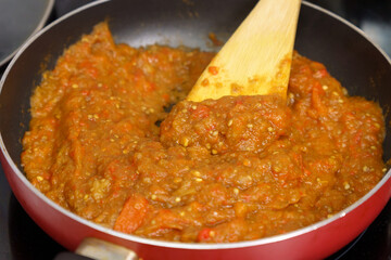 Cooking spread called Ajvar from red peppers and eggplants. Selective focus