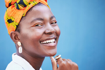 Portrait, black woman and smile with head wrap, natural beauty or confidence for cosmetics on blue...