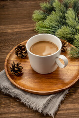 Obraz na płótnie Canvas Christmas decorations and coffee on wooden background. christmas concept.