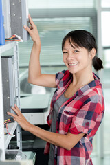 happy positive woman holding binder with documents