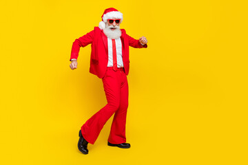 Fototapeta na wymiar Full length photo of funny santa dressed red suit tie dancing having fun discotheque empty space isolated yellow color background