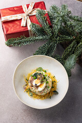 Merry Christmas. delicious salads on a gray background
