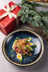 Merry Christmas. delicious salads on a gray background
