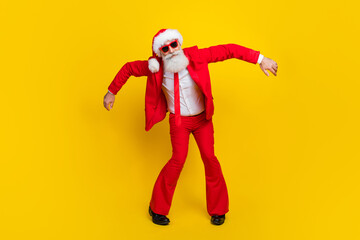 Full body portrait of excited positive aged person have good mood dance hang hands moves isolated on yellow color background