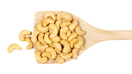 Cashew nuts in wooden spoon isolated on white background, top view