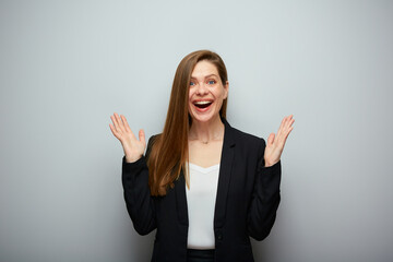 Excited business woman in black suit isolated portrait with copy space.