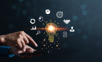 Businessman use smartphone management target business idea icon which for planning development leadership and customer target group concept..