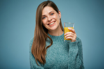 Healthy smiling woman holding orange juice in glass. Isolated female advertising portrait.