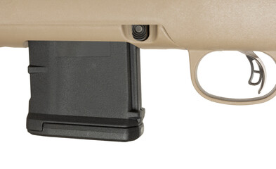 Black rifle magazine inserted just in front of the trigger