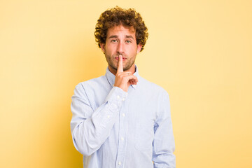 Young smart caucasian man on yellow background thinking and looking up, being reflective, contemplating, having a fantasy.