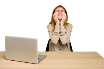 Young caucasian woman in a workplace working with a laptop isolated whining and crying disconsolately.