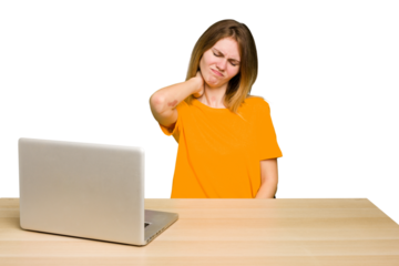 Young caucasian woman in a workplace working with a laptop isolated suffering neck pain due to sedentary lifestyle.