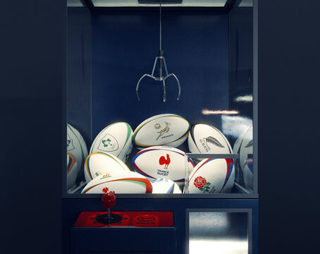 A concept 3D render of a arcade claw grab game filled with rugby balls imprinted with the top tier rugby nations colors and logos - December 7, 2022 in Bristol, United Kingdom