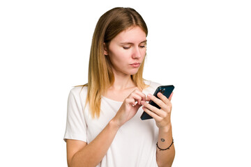 Young caucasian woman using a mobile phone cutout isolated