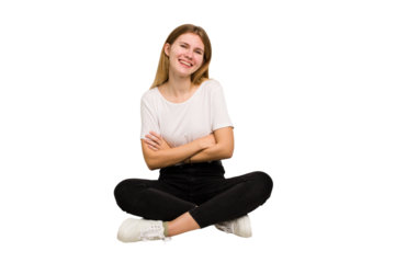 Young caucasian woman sitting on the floor cutout isolated