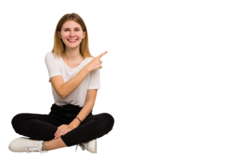 Young caucasian woman sitting on the floor cutout isolated