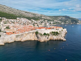 Dubrovnik Croatia walled town drone aerial view sunny day blue sky..
