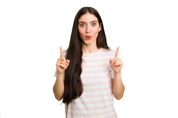 Young caucasian brunette long hair woman cutout isolated pointing upside with opened mouth.