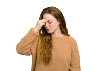 Young caucasian redhead woman isolated having a head ache, touching front of the face.