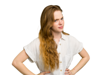 Young caucasian redhead woman isolated frowning face in displeasure, keeps arms folded.