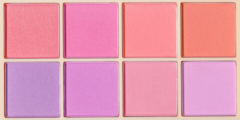 Vivid colored eye shadow makeup palette, pink, violet, red, purple colors. Woman cosmetic and beauty product, glitter eye shadow, aesthetic texture banner, tender pastel color photo