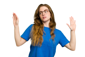 Young caucasian redhead woman isolated being shocked due to an imminent danger