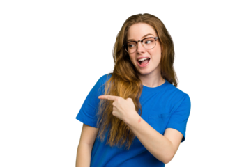 Young caucasian redhead woman isolated looks aside smiling, cheerful and pleasant.