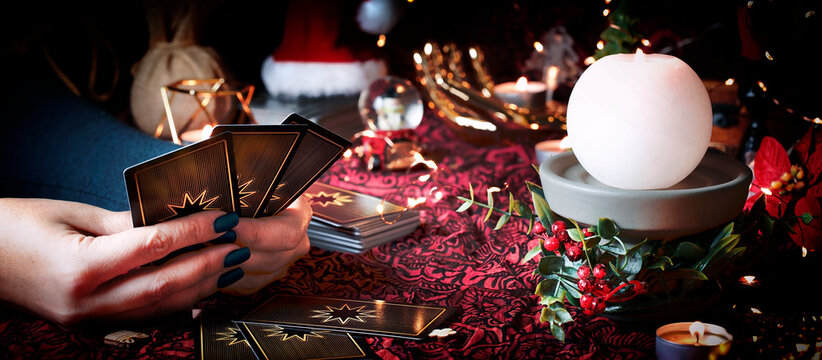  Tarot reader or Fortune teller reading on Christmas decoration.