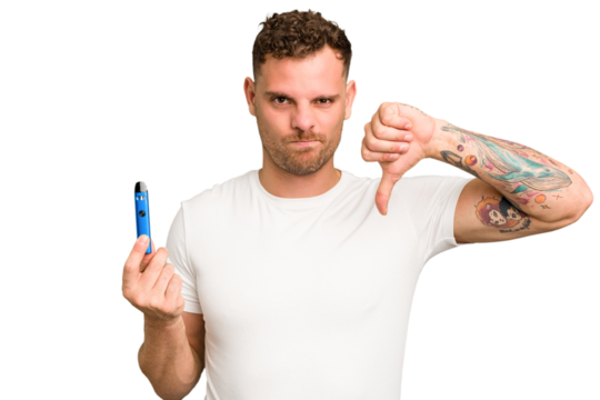 Young caucasian man holding a electronic cigarette isolated showing a dislike gesture, thumbs down. Disagreement concept.