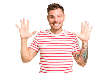 Young caucasian handsome man isolated showing number ten with hands.