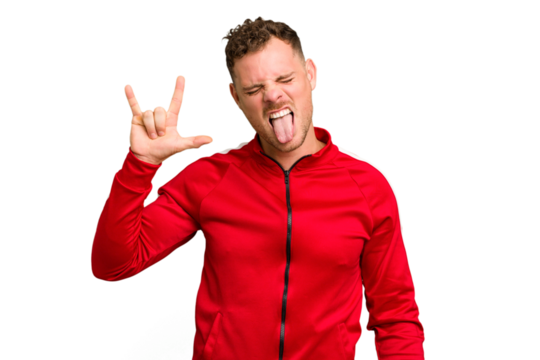 Young caucasian handsome man isolated showing rock gesture with fingers
