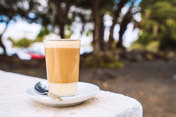 Three layers - coffee, milk and liqueur - makes delicious barraquito, specialty from Canary Islands