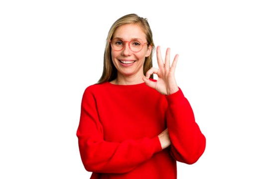 Young caucasian woman cutout isolated winks an eye and holds an okay gesture with hand.