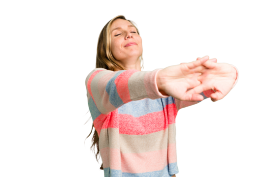 Young caucasian woman cutout isolated stretching arms, relaxed position.