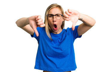 Naklejka premium Young caucasian woman cutout isolated showing thumb down and expressing dislike.
