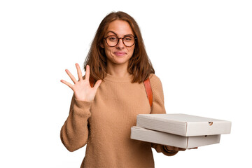 Young student woman holding pizzas isolated smiling cheerful showing number five with fingers.