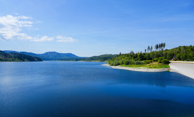 View of the Grane reservoir with the surrounding nature near Goslar. Landscape at the Granetalsperre in the Harz Mountains.
