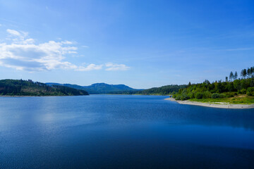 View of the Grane reservoir with the surrounding nature near Goslar. Landscape at the Granetalsperre in the Harz Mountains.

