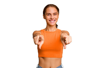 Young caucasian woman isolated cheerful smiles pointing to front.